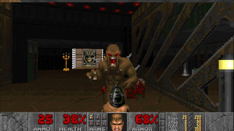 Eine Szene aus dem Spiel Doom. Aus der Ego-Perspektive wird eine Pistole auf ein braunes Monster gerichtet. Am unteren Bildrand stehen Informationen zur Spielfigur, wie Munition, Lebenspunkte und Rüstung.